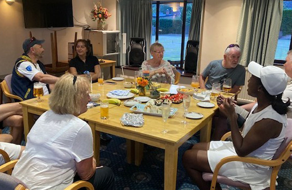 Tennis players socialising in the Pavilion.